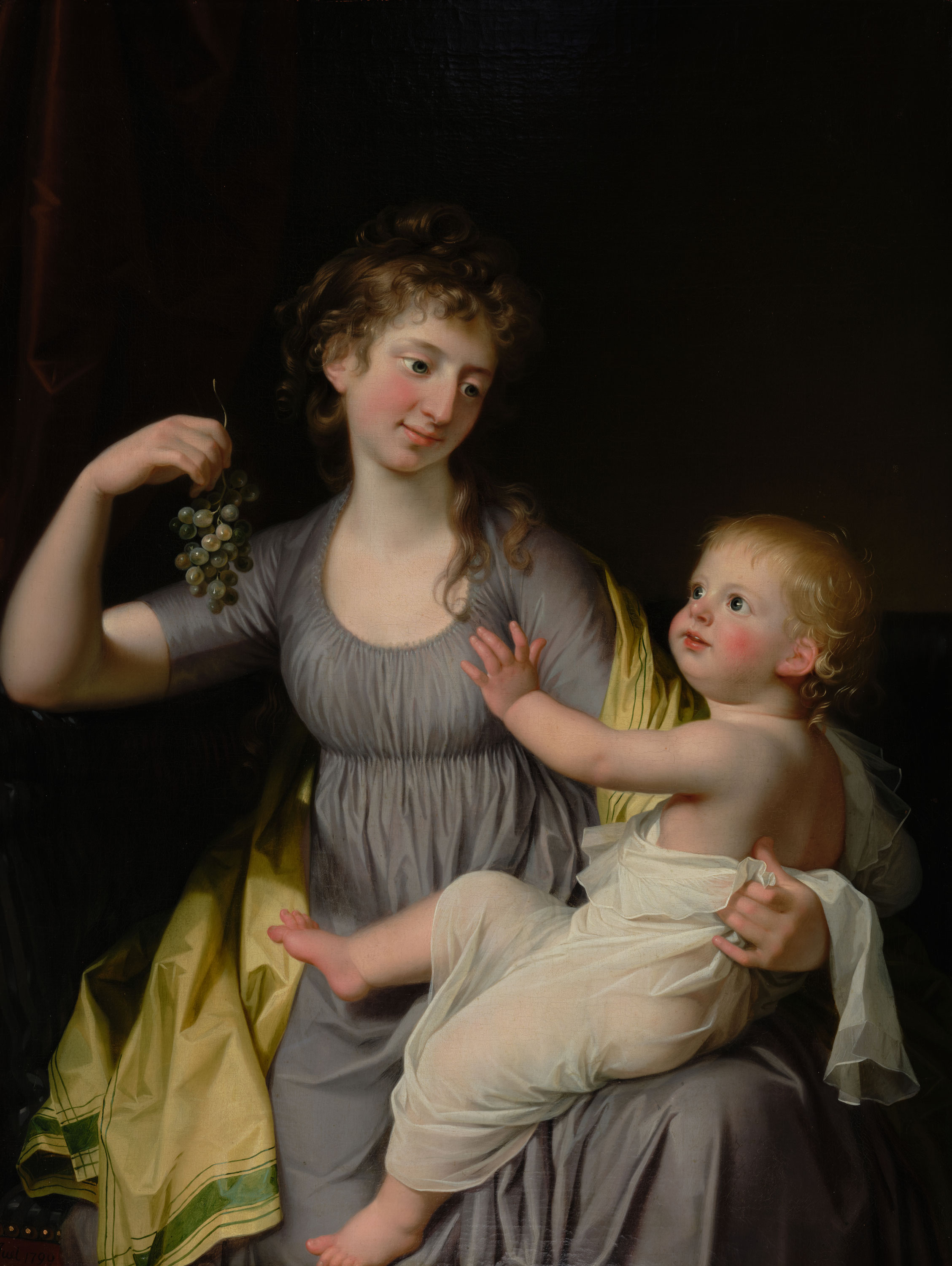 Das Gemälde zeigt eine Frau, die liebevoll ein kleines Kind auf ihrem Schoß hält. Sie trägt ein elegantes, fließendes Kleid und schaut mit einem warmen Ausdruck auf das Kind. In ihrer Hand hält sie eine grüne Rebe Weintrauben. Das Kind ist in ein schlichtes Tuch gehüllt und blickt zuversichtlich und neugierig zu ihrer Hand auf. Der Hintergrund ist dunkel, sodass die Figuren im Vordergrund hervorgehoben werden. 